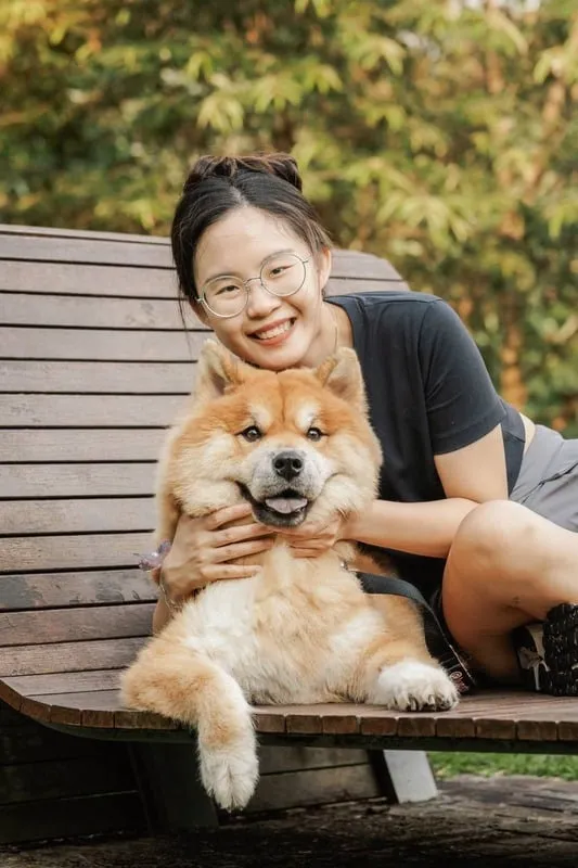 Luna the Chowpomsky Dog and owner